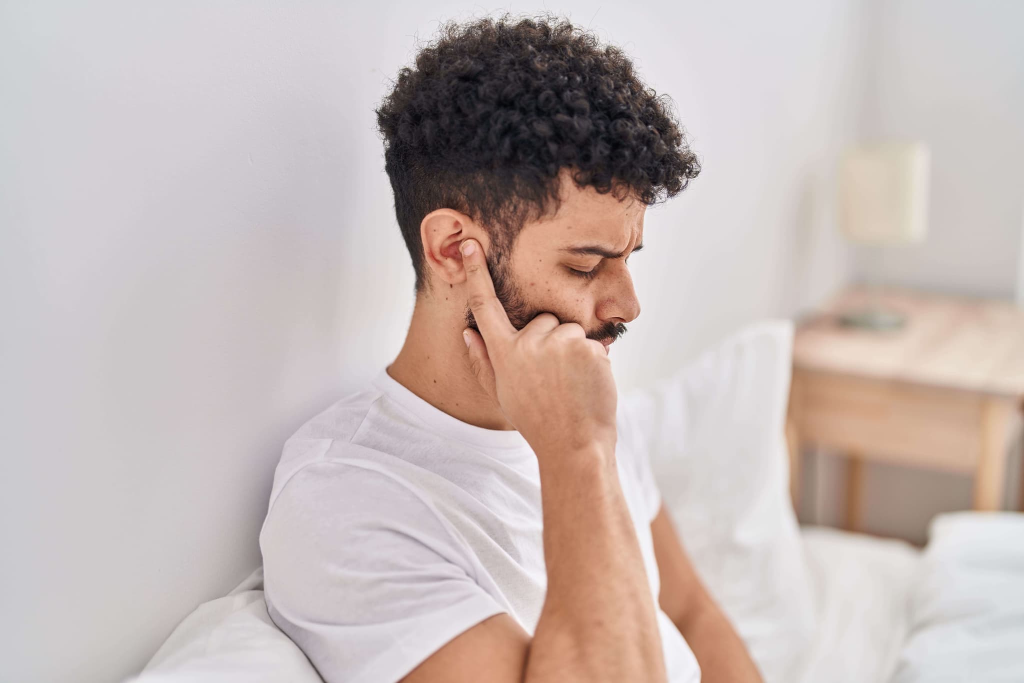 Young Arab man with ear pain - representing ENT care